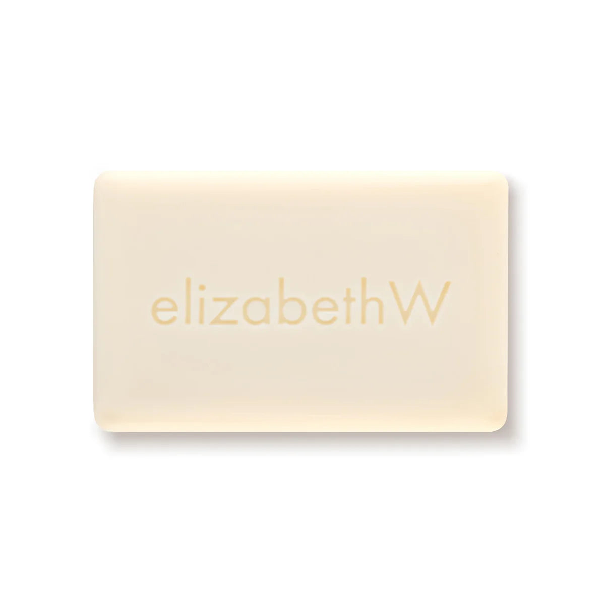 The elizabeth W Botanist's Scent Lab Tuberose Bar Soap, a rectangular beige soap bar featuring the elegant "elizabethW" embossing, promises a luxurious bathing experience with its exquisite fragrance, all set against a plain white backdrop.