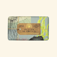 A bar of The English Soap Co. Anniversary Ocean Seaweed Soap, from The English Soap Company, featuring elegant recyclable packaging with marine-themed illustrations and pastel colors.