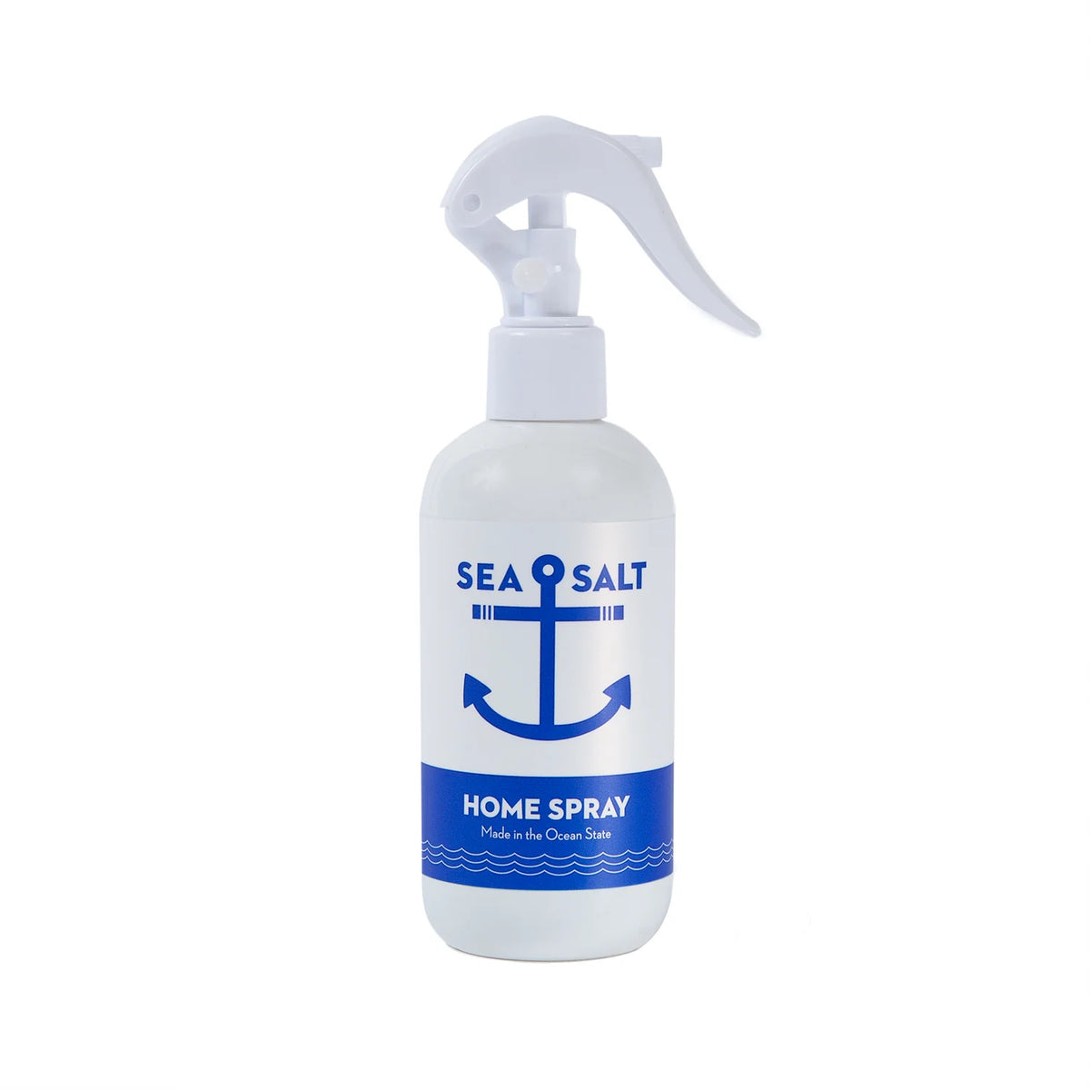 The white spray bottle from Kala, labeled "Swedish Dream® Sea Salt Home Spray," showcases a blue anchor design. Below the anchor, you'll find "Made in the Ocean State" printed. This vegan and cruelty-free product boasts a phthalate-free formula with a user-friendly white nozzle on top.