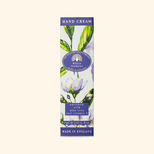 A rectangular box of The English Soap Co. White Jasmine Hand Cream adorned with an illustration of white jasmine flowers and green leaves. The text mentions it is enriched with aloe vera, shea butter, and vitamin E and measures 75 ml (2.5 US fl. oz). The label indicates it is made in England.