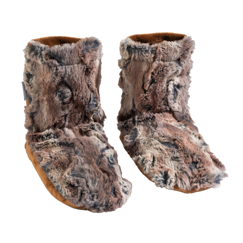 A pair of Sonoma Lavender Timber Lake Warm Chestnut Spa Booties with fluffy exteriors in shades of gray and brown, isolated on a white background.