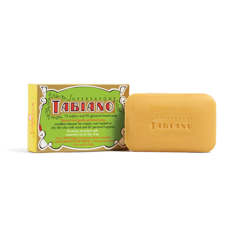 A yellow Kala Tabiano Bar Soap with Tea Tree & Sulfur is shown beside its green, white, and yellow box displaying branding. The antibacterial bar has "Tabiano" embossed on its surface.