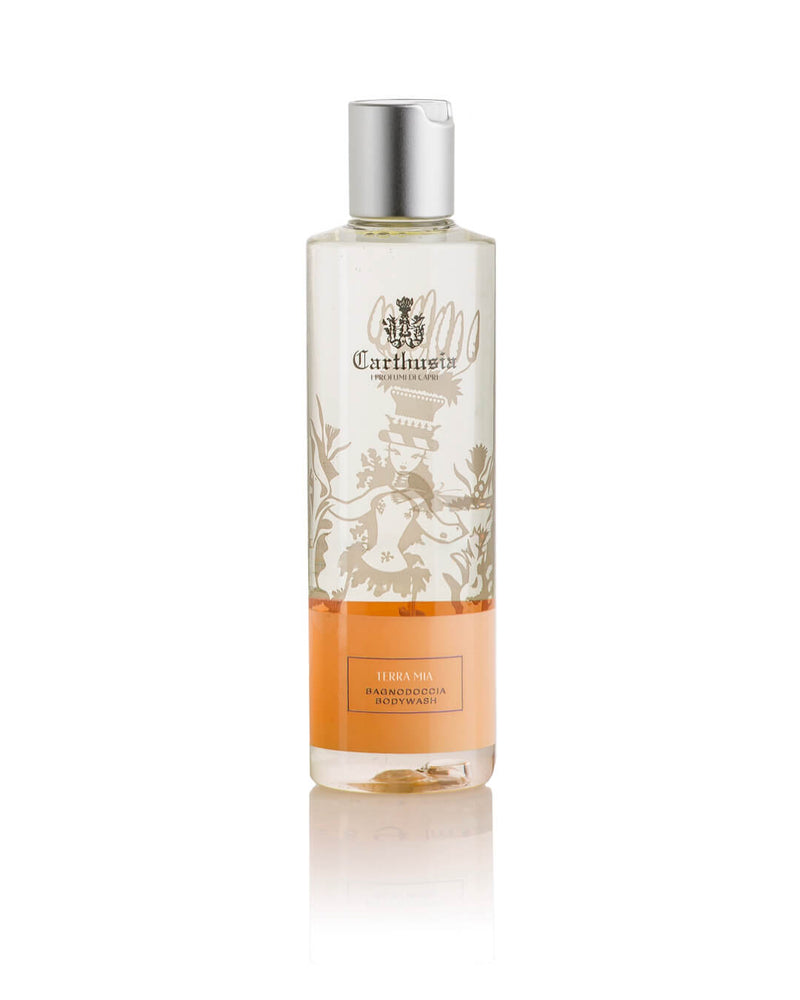 A clear plastic bottle with a silver cap holds orange gel. The label, featuring a floral design, displays "Carthusia I Profumi di Capri" and "Terra Mia Shower Gel." This luxurious unisex product is shown on a white background.