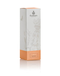 A rectangular Carthusia I Profumi di Capri box with a pale gray top and peach base, adorned with illustrations and logo, ideal for gifting with the unisex Carthusia Terra Mia Shower Gel.