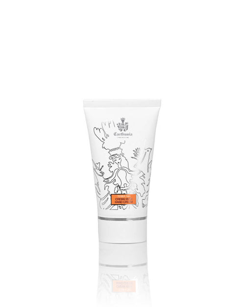 A white tube of Carthusia I Profumi di Capri Terra Mia Hand Cream, decorated with black-outlined floral and bird designs and an orange label, promises Mediterranean-inspired skincare against a plain white background.