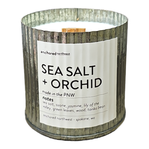 The Anchored Northwest Sea Salt & Orchid Rustic Vintage Farmhouse Wood Wick Candle, made from soy wax and essential oils in Spokane, WA, blends sea salt, ozone, jasmine, lily of the valley, green leaves, wood, and tonka bean scents.