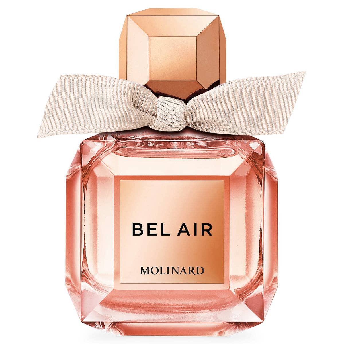 The Molinard Bel Air Eau de Toilette features a pink bottle with a faceted rose-gold cap and cream ribbon, reflecting the floral elegance of this perfume crafted by Molinard.