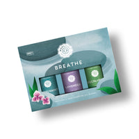 The Woolzies The Breathe Essential Oil Collection gift box includes three 100% natural blends—peppermint, lavender, and eucalyptus essential oils—packaged with a leaf and flower design.