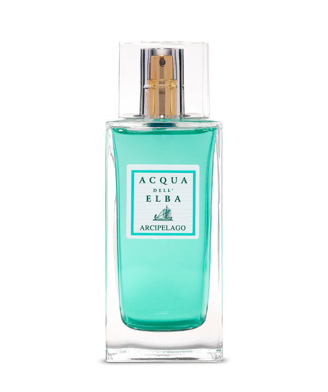 Acqua dell'Elba Arcipelago Donna Eau de Parfum (100ml) is a clear glass bottle with turquoise liquid, gold-silver spray nozzle, and white label with teal text and boat art, evoking the floral scents of Italy’s Tuscan Archipelago.