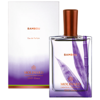 A Molinard Bambou Eau de Parfum bottle featuring a purple bamboo design and copper cap sits before its matching white and purple box, reflecting the Asian bamboo fragrance by Molinard.