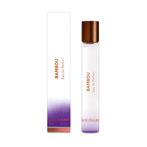 A clear glass Molinard Bamboo Eau de Parfum Roll-On (7.5 ml) with a copper cap is shown beside its white, purple, and copper accented box, both labeled "BAMBOU Eau de Parfum MOLINARD," containing a floral-spicy fragrance.