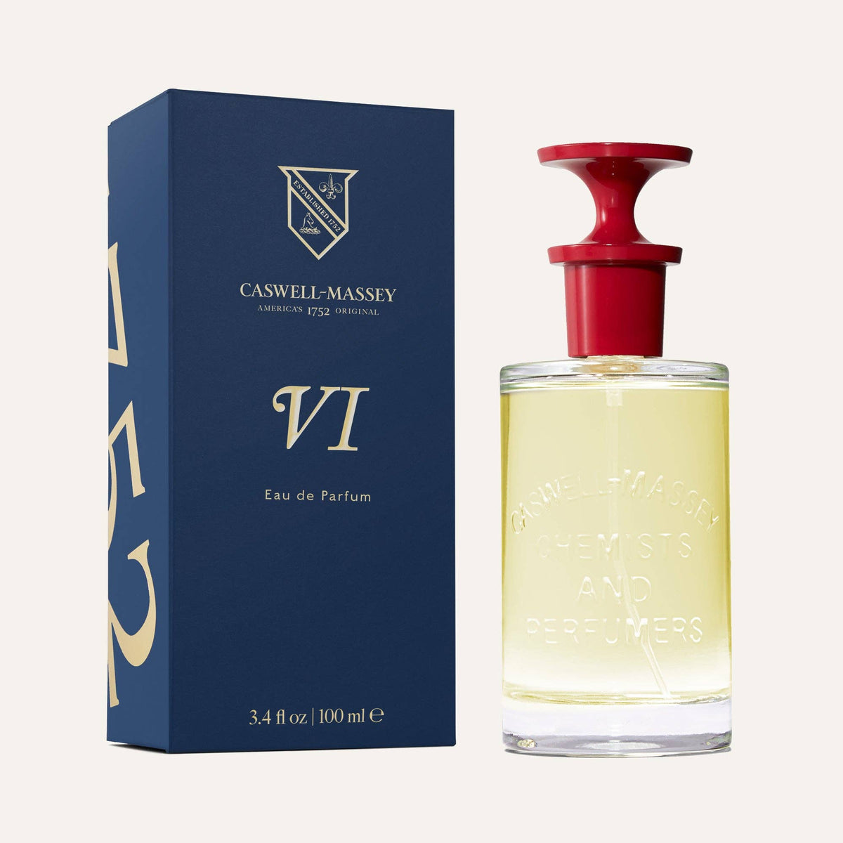 A 3.4 fl oz (100mL) bottle of Caswell-Massey Number Six Eau de Parfum with a red cap is displayed beside its blue and gold box. This iconic fragrance is by Caswell-Massey.