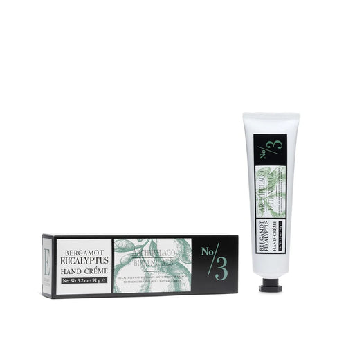 A tube and box of Archipelago Botanicals’ Archipelago Bergamot Eucalyptus Hand Creme, featuring white and green packaging with black accents and natural ingredients—your new hydrating hand care essential.