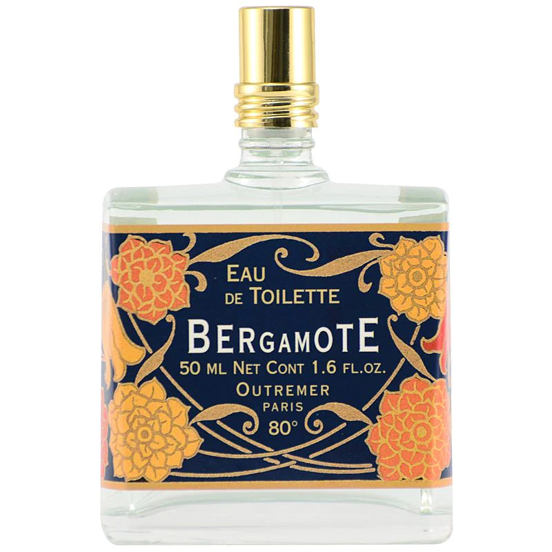 A square bottle of Outremer - L'Aromarine Bergamote Eau de Toilette, featuring a decorated label with orange blossom designs and gold accents on a navy-blue background.