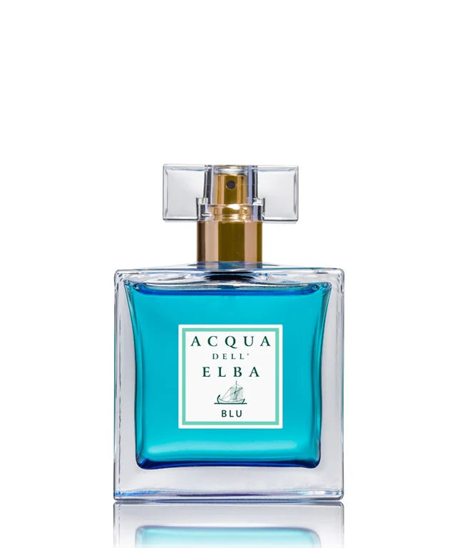 A 50ml bottle of Acqua dell'Elba Blu Donna Eau de Parfum features a clear square cap and a golden spray nozzle. The glass container holds vibrant blue liquid, embodying a floral and woody fragrance, with a white label displaying green text, set against a pristine white background.