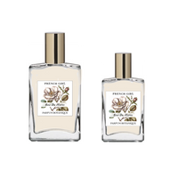 Two glass bottles labeled "FRENCH GIRL Eau Du Maroc Organic Vegan Natural Aromatherapy Perfume," featuring floral illustrations and gold caps, display this alcohol-free vegan scent made with essential oils, set against a plain white background.