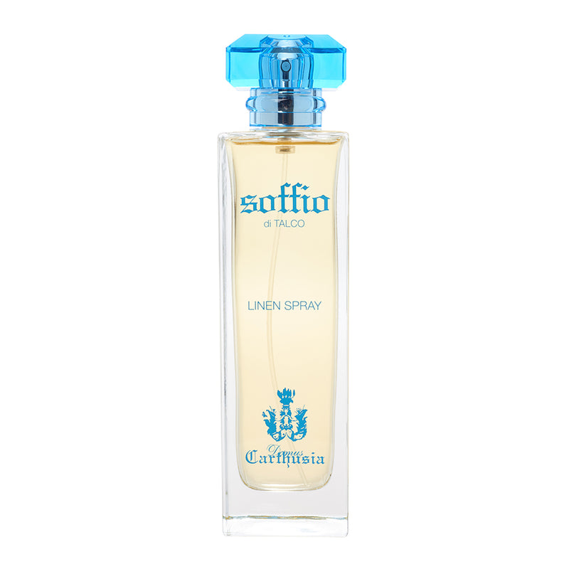 A clear glass bottle of "Carthusia Linen Fragrance - Talco" linen perfume by Carthusia I Profumi de Capri, with a light blue cap and elegant black and blue label featuring a crest graphic.