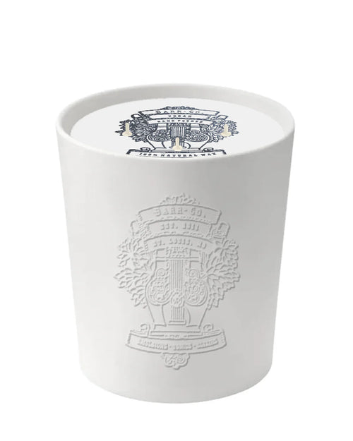 The Barr-Co. Original Scent Ceramic Embossed Candle features a matte holder with an embossed crest, a matching printed crest on the wax, and offers a long-lasting fragrance.
