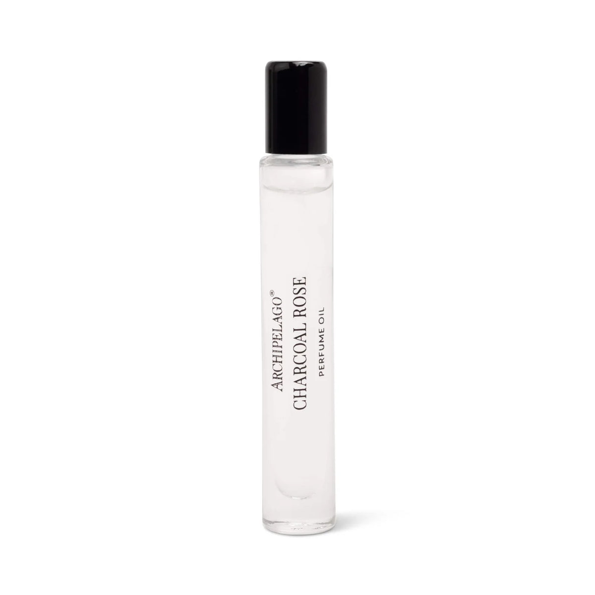 A clear glass rollerball bottle with a black cap, labeled "Archipelago Charcoal Rose Perfume Oil" by Archipelago Botanicals, stands upright against a white background. This long-lasting perfume features bold black text on the front.