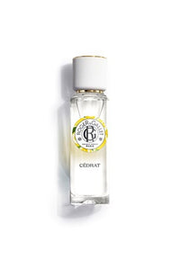 A clear glass bottle of Roger & Gallet Citron Wellbeing Fragrant Water 1 oz with a white and gold cap and a white label showing the brand name, photographed on a white background.