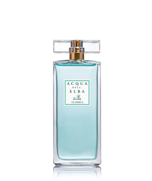 The Acqua dell'Elba Classica Donna Eau de Parfum 50ml features a clear glass bottle filled with light blue liquid, radiating a feminine scent inspired by the Mediterranean Maquis. The label showcases the Acqua dell'Elba brand name along with an image of a small sailboat, and it is topped with a rectangular, transparent cap.