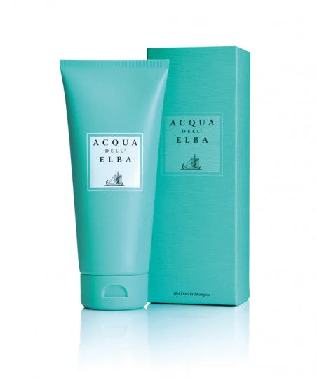 A turquoise tube and matching box of Acqua dell'Elba Classica Donna Shower Gel, both displaying the Acqua dell'Elba brand name and a sailboat graphic, are shown upright against a white background.