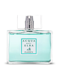 A clear glass bottle of Acqua dell'Elba Classica Uomo Eau de Parfum - 100ml features light blue liquid and a rectangular label with the Acqua dell'Elba brand and sailboat graphic, evoking a fresh Mediterranean scent.