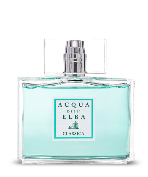 A clear glass bottle of Acqua dell'Elba Classica Uomo Eau de Parfum - 100ml features light blue liquid and a rectangular label with the Acqua dell'Elba brand and sailboat graphic, evoking a fresh Mediterranean scent.