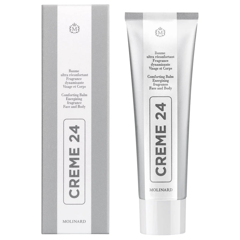 A tube and box of Molinard Creme 24 by Molinard, a soothing face and body balm. Both are white and silver with black text showing the product name vertically and additional details in English and French.