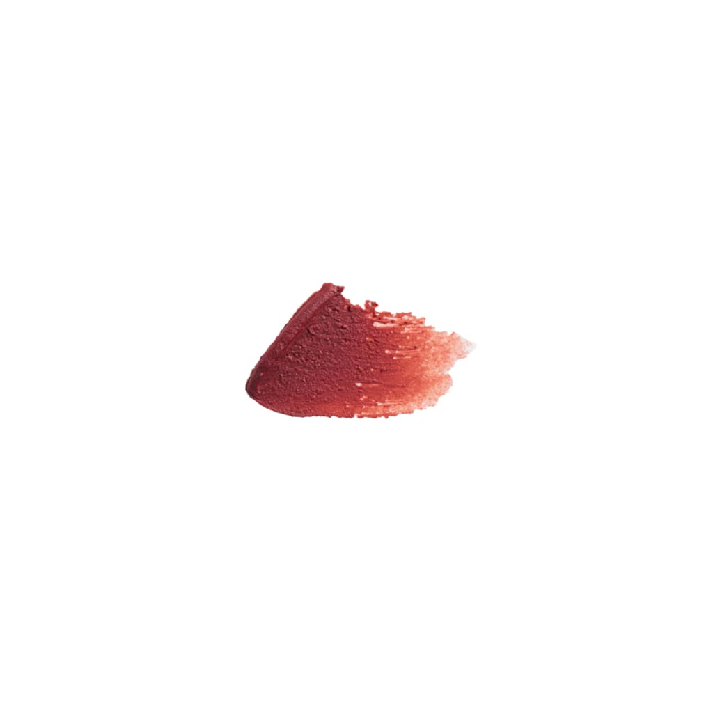 A swatch of FRENCH GIRL Tinted Lip Balm in Cerise is smeared on a white background, displaying a gradient from deep red to soft pink.