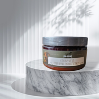 A jar of Fox + Hound Stormies Paw Protection - All Season sits on a round marble pedestal, with vertical white blinds and soft shadows in the background, highlighting this essential dog paw care product.