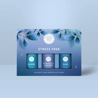 A blue Woolzies Stress Free Collection box with leaf designs holds three 10ml calming oils: Unwind, Enchanting Lavender, and Sleep—Woolzies’ natural relaxation essentials.