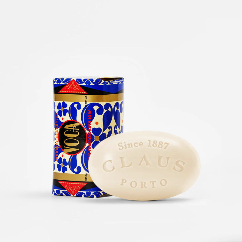 A bar of Claus Porto Voga Acacia Tuberose Soap - 150gm beside its decorative blue and red packaging, both featuring floral motifs and the brand details on a white background.