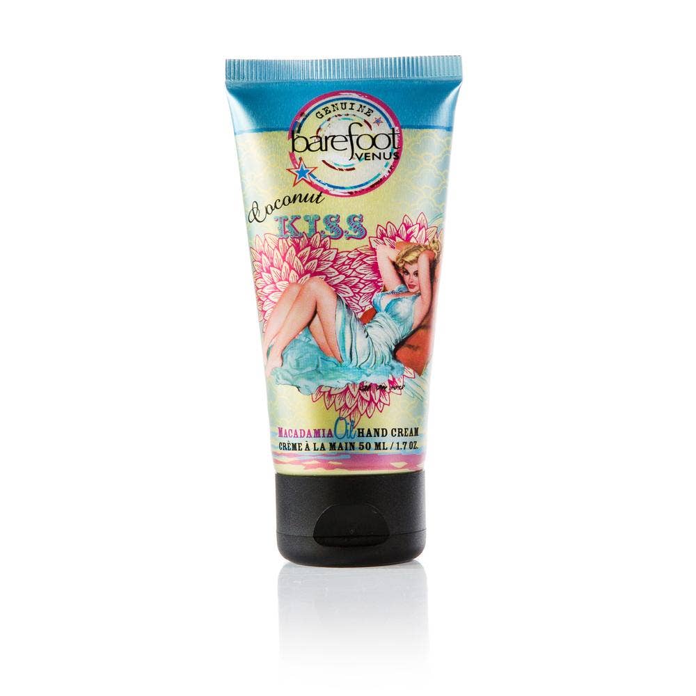 A 50 mL tube of Barefoot Venus Coconut Kiss Hand Cream is shown. The packaging features vintage-style artwork of a reclining woman surrounded by flowers. Text on the tube includes the product name and size, highlighting its use of natural ingredients and paraben-free formula.