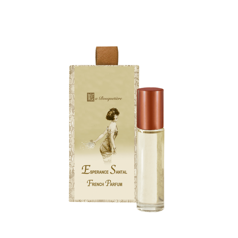A vintage-inspired La Bouquetiere French perfume package with a beige box featuring an elegant illustration of a woman and a La Bouquetiere Esperance Santal French Perfume Roller with a gold cap.