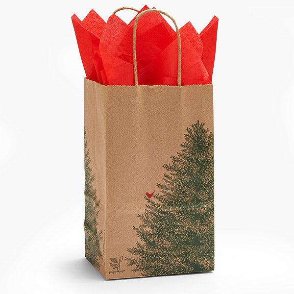The Evergreen 100% Recycled Paper Bags 5.5x3.25x8.5" by Nashville Wraps feature green pine trees and a red bird, finished with natural twisted handles and bright red tissue—an eco-friendly gift packaging choice.