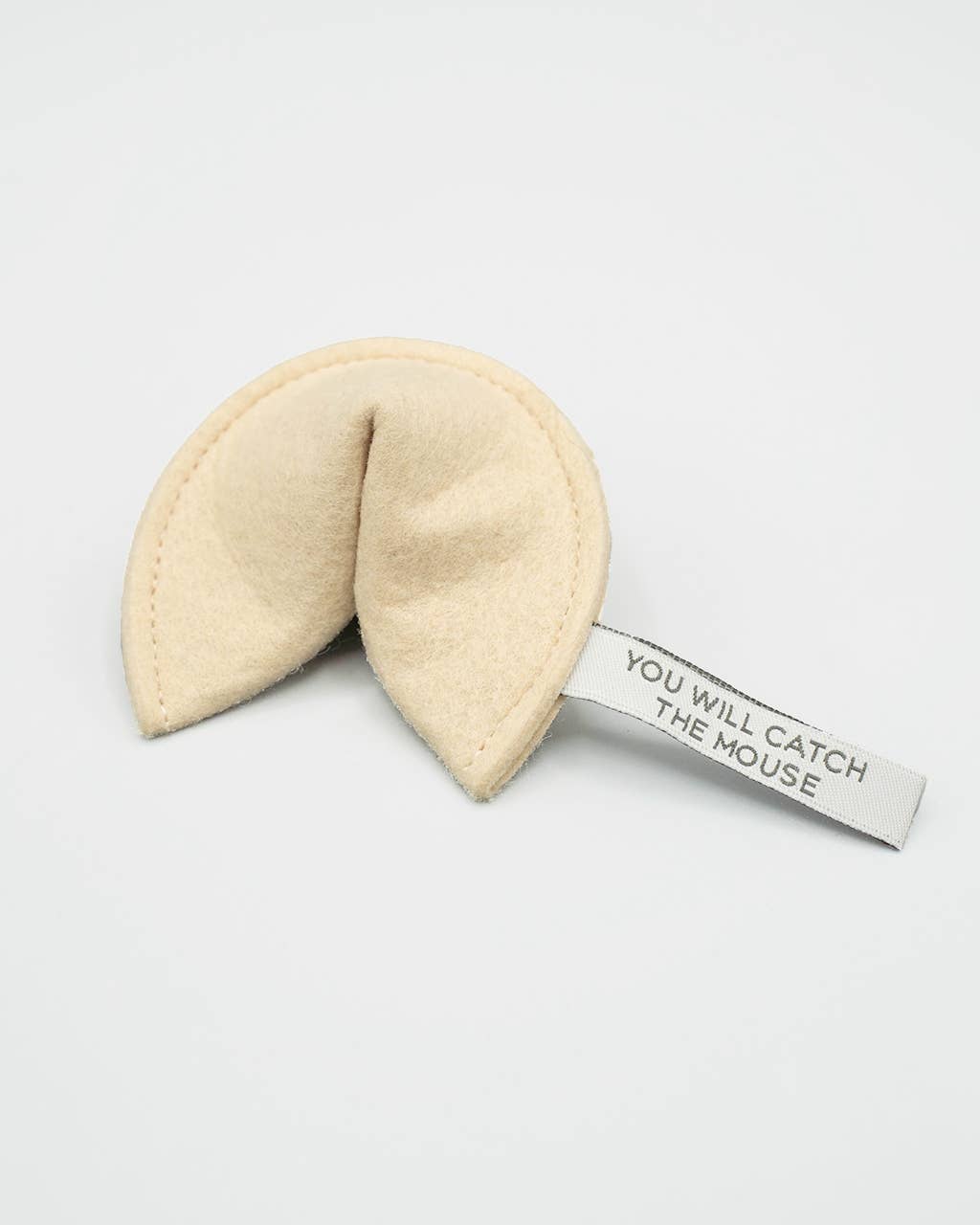 The MODERNBEAST Kitty Fortune Cookie Organic Catnip Cat Toy is a plush eco felt toy with a tag reading "YOU WILL CATCH THE MOUSE," filled with organic catnip and shown against a white background.