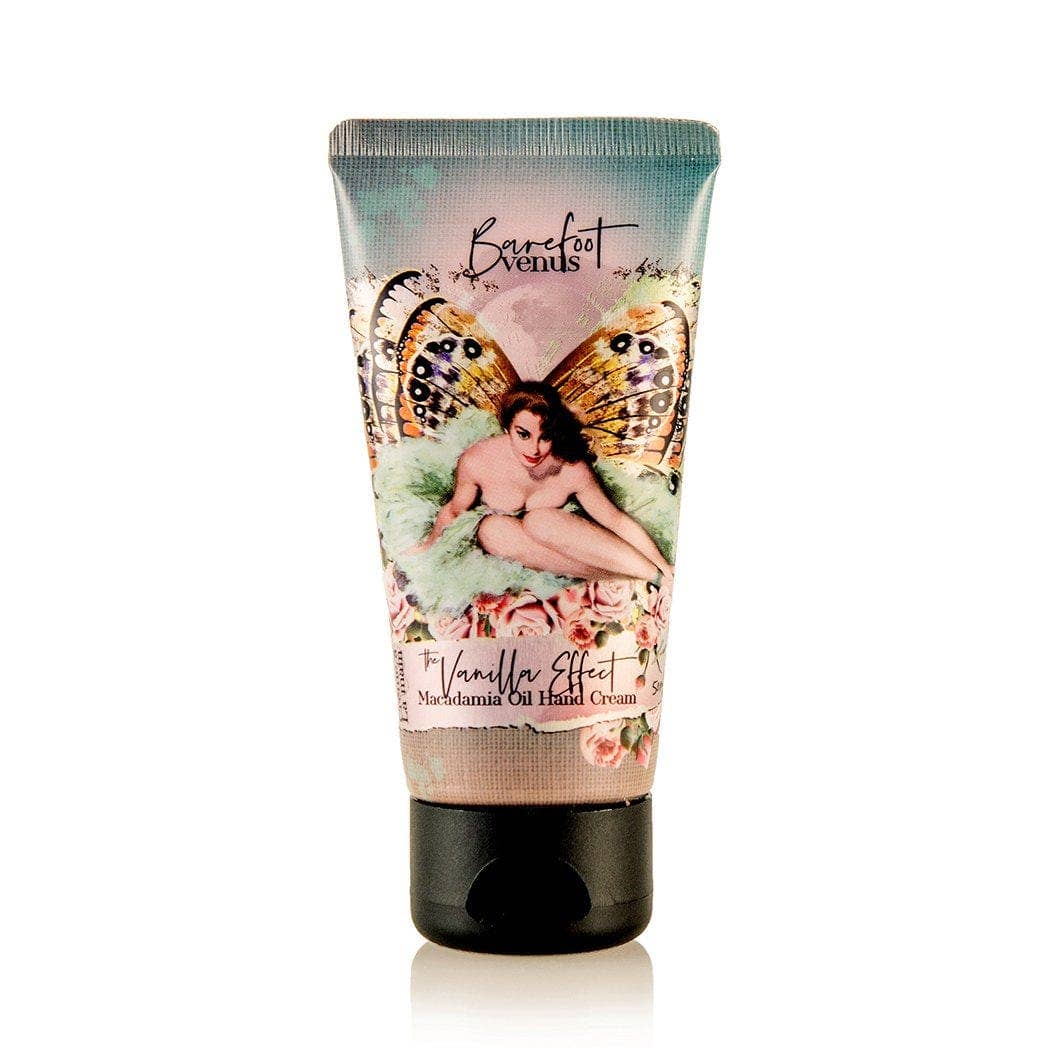 Tube of hand cream featuring an illustrated design of a woman with butterfly wings sitting among flowers. The product, named "Barefoot Venus The Vanilla Effect Hand Cream," contains rich macadamia nut oil and has a black cap.