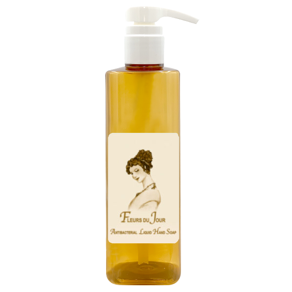A pump bottle of La Bouquetiere Fleurs du Jour / Marina Blue Antibacterial Liquid Hand Soap features a charming vintage-style illustration of a woman and offers a fresh-flower scent with soothing aloe vera.