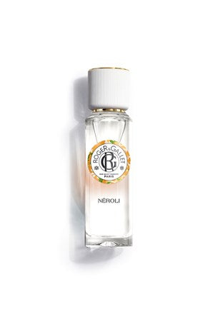 A clear glass bottle of Roger & Gallet Neroli Wellbeing Fragrant Water 1 oz with a white cap and gold accents sits on a white background. The label displays the Roger & Gallet logo and highlights Orange Blossom notes under "NÉROLI.