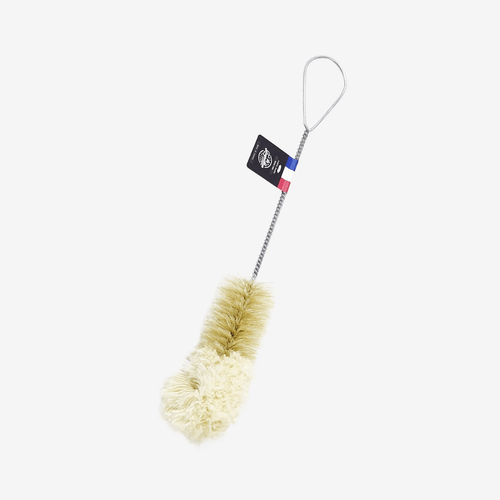 The Andrée Jardin Bistro Flute Cleaning Brush features natural bristles, a twisted metal handle with a loop, and a French flag ribbon tag—ideal for cleaning champagne flutes. Shown on a plain white background.