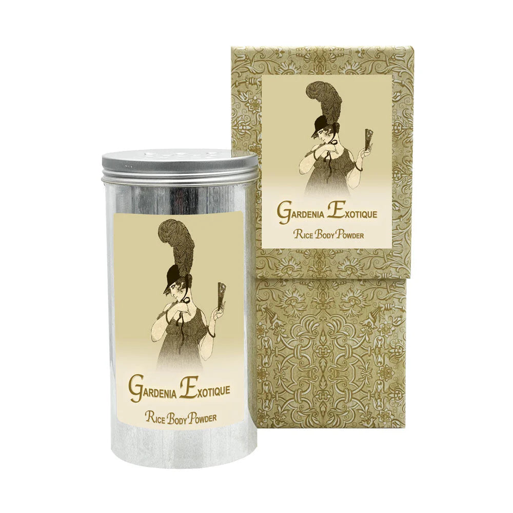 A tin of La Bouquetiere Gardenia Rice Body Powder Canister, showcasing a vintage-style illustration of a person wearing a grand feathered hat and holding a fan. The background displays an ornate floral pattern, while the powder provides moisturizing benefits and exudes a delicate natural fragrance.