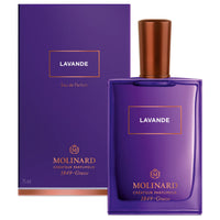 A purple Molinard Lavender Eau de Parfum bottle with a copper cap and gold text, plus a matching purple and gold box featuring the brand details. This Provence fragrance offers a floral woody scent.