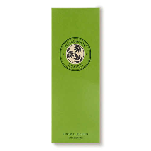 A tall, green rectangular box labeled "elizabeth W Botanist's Scent Lab Leaves Diffuser" with a circular leaf logo. The bottom text reads "ROOM DIFFUSER 8.45 fl oz (250 ml)." Features elizabeth W’s signature leafy fragrance.