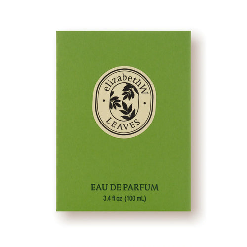 A green rectangular box features the "elizabeth W Botanist's Scent Lab LEAVES" text inside an oval logo at the top center. Below this logo, you will find "Leaves Eau de Parfum Natural Fragrance" and the volume details "3.4 fl oz (100 mL)" printed on the box.