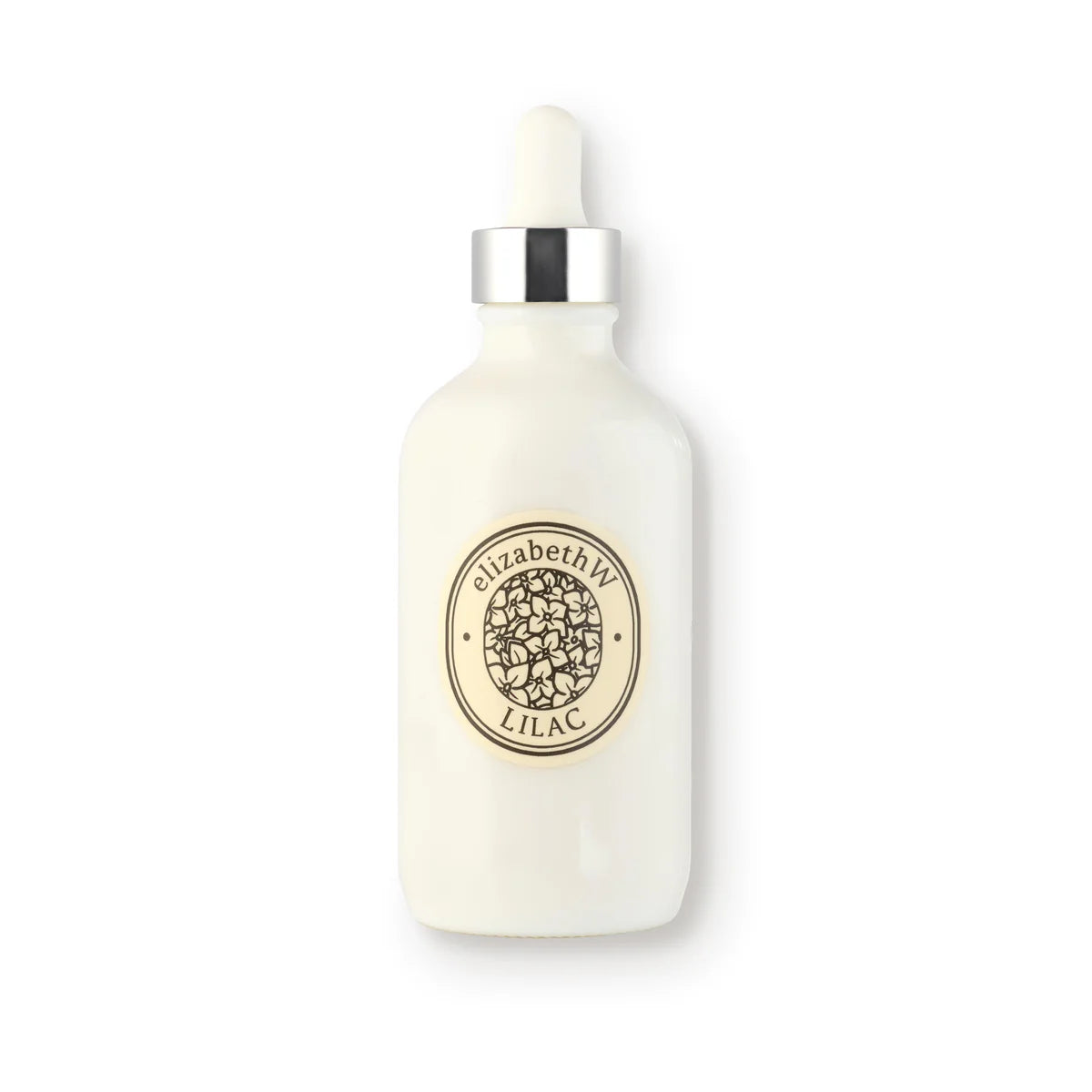 A white dropper bottle with a silver cap features a label that reads "elizabeth W Botanist's Scent Lab Lilac Body Oil," adorned with a floral design in the center. This lilac body oil bottle stands upright against a plain white background, offering an elegant and nourishing experience.