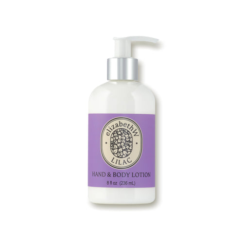 A bottle of elizabeth W Botanist's Scent Lab Lilac Hand & Body Lotion with a pump dispenser. The label is purple with an oval logo featuring lilac flowers and the brand name. Text below the logo reads "HAND & BODY LOTION" and size "8 fl oz (236 ml)." Enjoy lasting hydration with its delightful lilac fragrance.