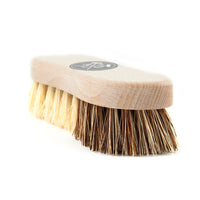 The Andrée Jardin Hard and Soft Fibers Vegetable Brush features natural bristles, a curved French beech wood handle, and a dual-fiber design. The round black-and-white Andrée Jardin logo sits on top, all displayed against a white background.