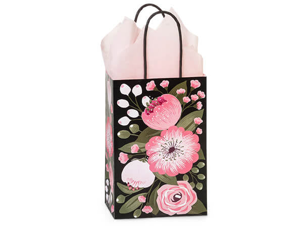 The Nashville Wraps Moonlit Blooms Paper Gift Bag, 5.5x3.25x8.5", features black kraft paper with pink and white floral designs and black handles, filled with pale pink tissue for chic, eco-friendly gift packaging.