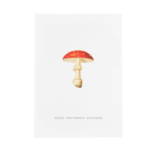 The TokyoMilk Mushy Sentiments Enclosed Greeting Card by Margot Elena features a red and white mushroom illustration with "mushy sentiments enclosed" printed below on textured paper—perfect for heartfelt messages.
